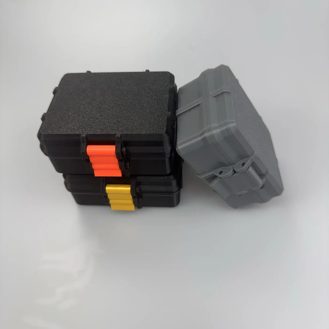 three shipped colorways of the 20-slot peptide case stacked — mixed bulk pack